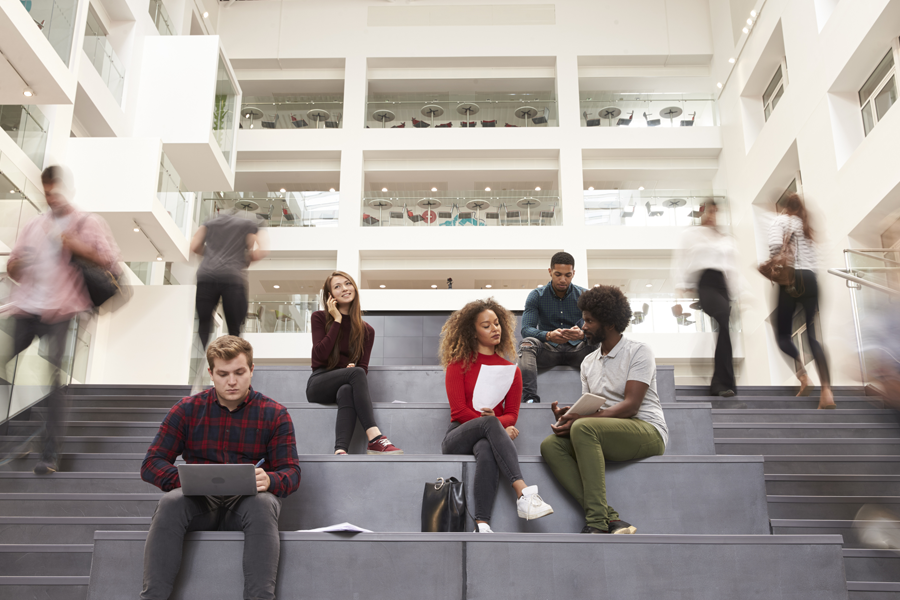 Borrower Resources & Payment Portal An image of a group of students sitting on the stairs and chatting.