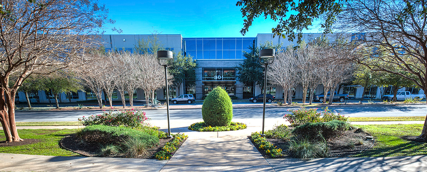 An image of the front of the Trellis Company headquarters building in Round Rock, Texas.