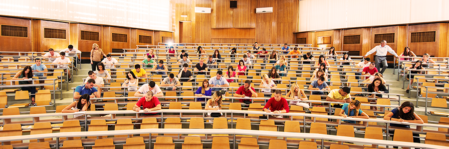 An image of a university lecture hall with students.