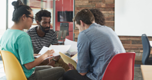 An image of a group of students working on their class project.